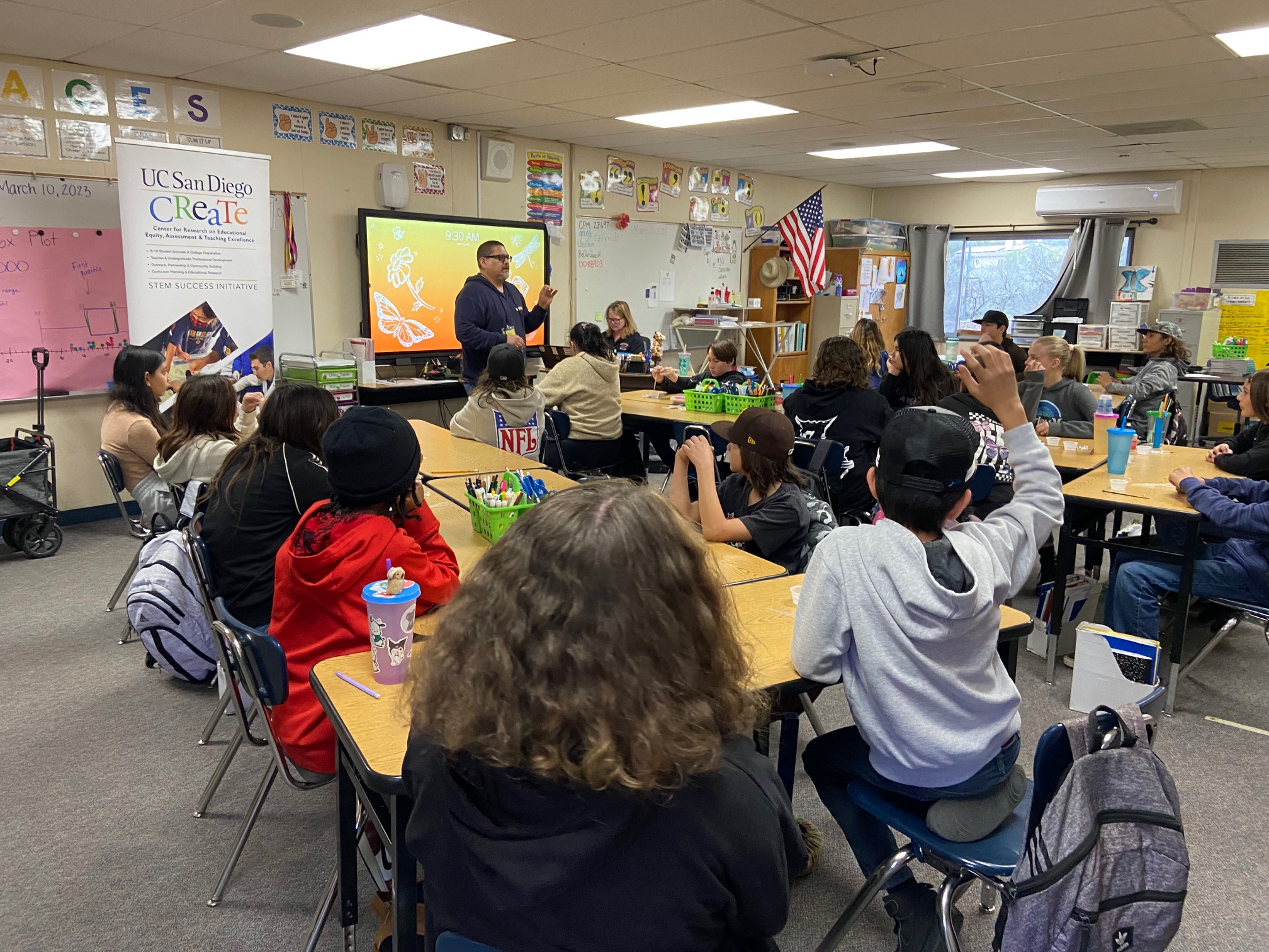 Students in a classroom participating in a CREATE program presentation 